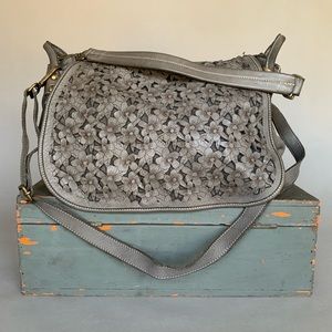 Costanza Rota floral cut leather bag with natural markings and clean interior.